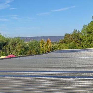 Top of an Alumawood patio cover with great veiw of trees in the background.