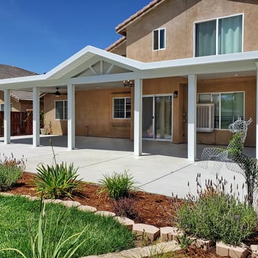 Aluminum patio cover with peaked roof.