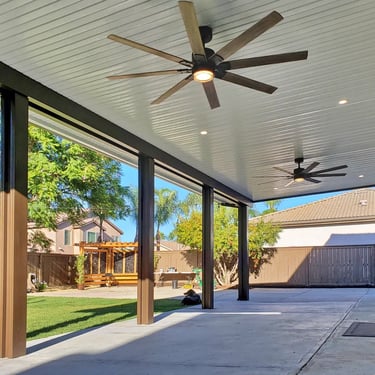 Solid Alumawood cover with large ceiling fans.