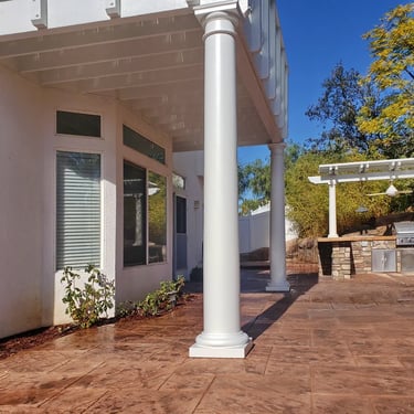 Wood balcony and patio cover with 12" round deocoartive columns.