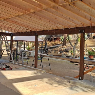 Heavy patio roof structure being framed in J-Bar Ranch
