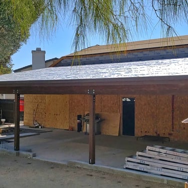 Large wood patio roof with roof underlayment installed.