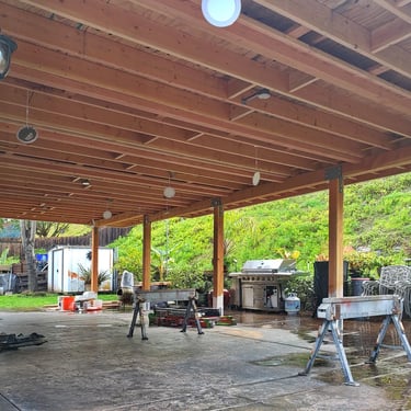 Patio roof framing with beams, blocking, electrical, and sound system.