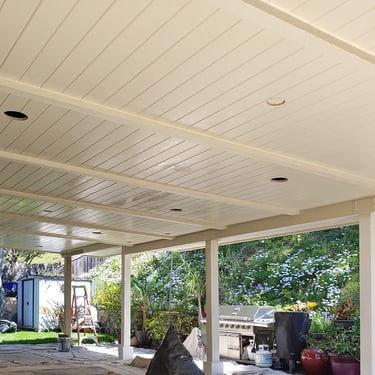 Large wood patio with Dunn Edwards Ultra-Grip primer applied.
