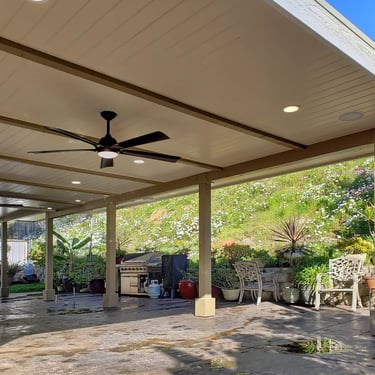 Custom wood patio structure with finished ceilings and electrical for lighting and fans.