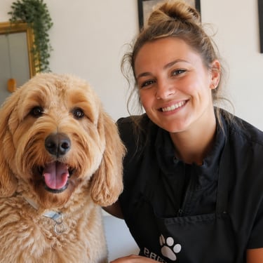 Smiling female with a happy fluffy dog in a calm lounge