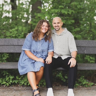 Nate and Jenna Dukes sitting on a park bench, smiling, after launching their first rental with Brock Office Solutions.