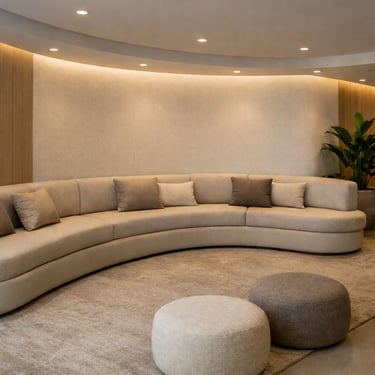 Curved banquette seating in a lounge waiting area with modern styling