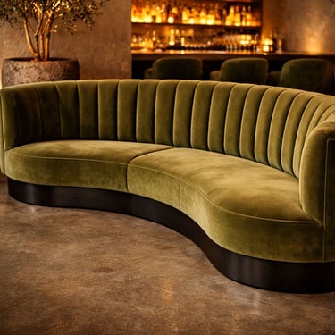 Custom curved olive green velvet banquette with channel tufting and sculptural base by Solo Home Decor