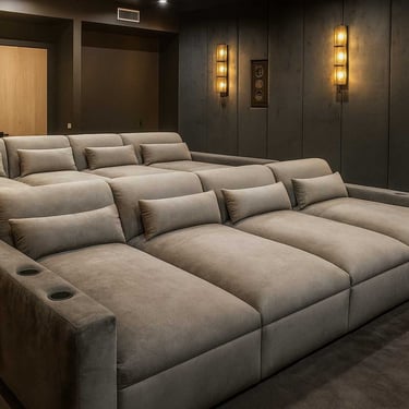 Velvet theater seating with cup holders and tiered rows by Solo Home Decor for home cinema.