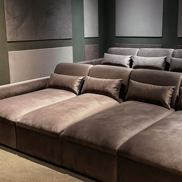 Luxurious custom home theater seating with cushions and matching panels, designed for comfort and style by Solo Home Decor