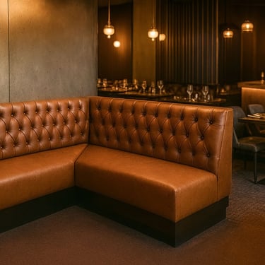 Luxurious tufted leather banquette in a fine dining restaurant setting by Solo Home Decor