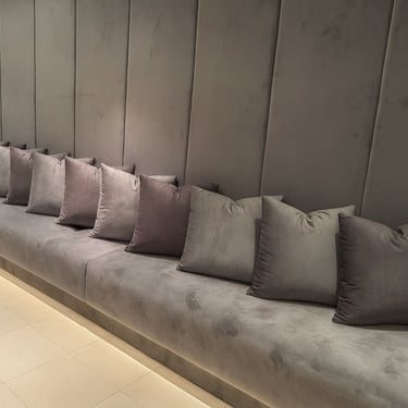Solo Home Decor upholstered wall bench with soft cushions and modern design for elegant custom seating.