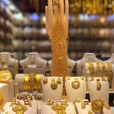 a display of gold jewelry and jewelry
