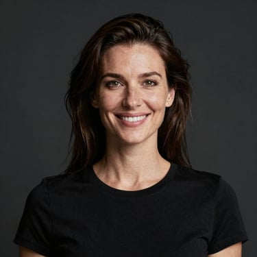 Portrait of a smiling woman with short hair in a cozy office setting.