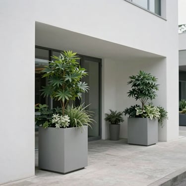 A square-cropped shot of a series of monolithic outdoor planters lining a minimalist building entrance under diffused light.