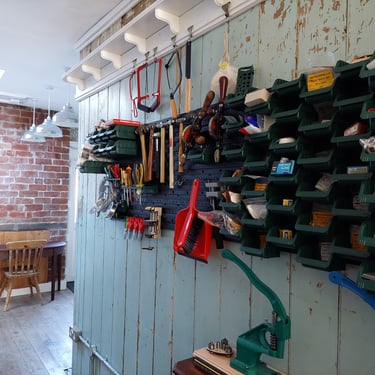 Racks of tools on a blue wall
