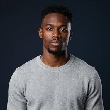 A smiling young woman working on her laptop in a cozy, bright home office.