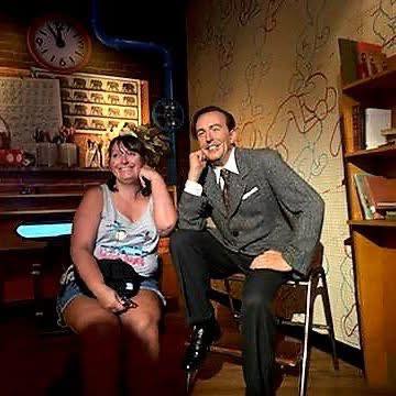 Woman with Walt Disney in wax museum, Orlando Florida