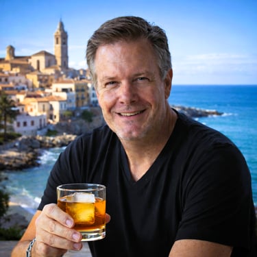Photo of the author with a Spanish seaside old town in the background