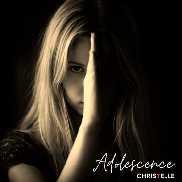 A moody, sepia-toned portrait of a young blonde woman with her face partially hidden by her hand.
