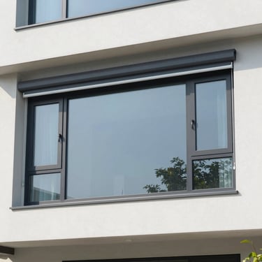 High-quality PVC window frames with integrated automatic roller shutters on a modern residential facade