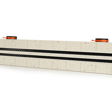 ERGOVENT LINEO PRO PUZZLE 2-slot 75x1050mm angled view showing gypsum body with dual black slot grilles and puzzle lock edges