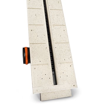 ERGOVENT LINEO PRO PUZZLE end view showing gypsum body depth, black slot grille, orange duct inlet and puzzle lock joint
