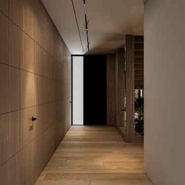 Warm residential corridor with ERGOVENT LINEO diffuser along white ceiling, floor-to-ceiling wood paneling and pivot door.