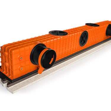 ERGOVENT LINEO PRO PUZZLE angled view showing orange plenum body with multiple round duct inlets and gray gypsum base