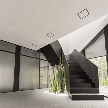 Modern entrance hall with ERGOVENT KVADRO diffusers flush-mounted in concrete ceiling above black staircase and cactus.