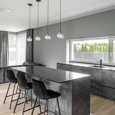 Luxury open kitchen island with ERGOVENT RONDO diffusers flush-mounted invisibly in white ceiling.