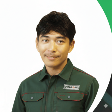 Professional Field One service technician smiling in a green company uniform