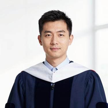 Professional headshot of a male academic, clean white background, sharp focus, academic attire