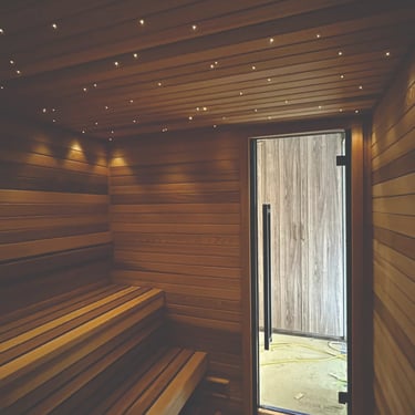 Scandinavian sauna interior with star ceiling lights and cedar benches crafted for Outdoor sauna Ontario