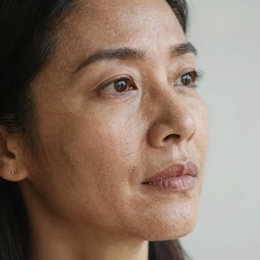 Close-up of a sleek, modern workspace with a laptop showing a creative website design.