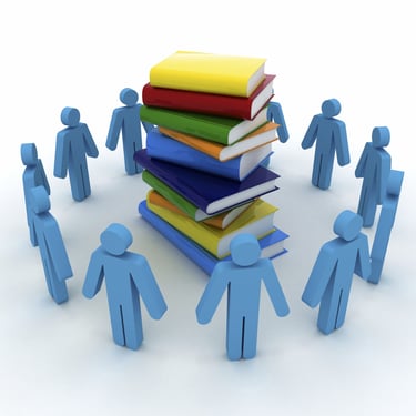 Graphic of a circle of people shapes looking at a pile of books.