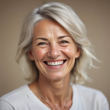 A joyful woman reading the e-book outdoors with sunlight filtering through trees.
