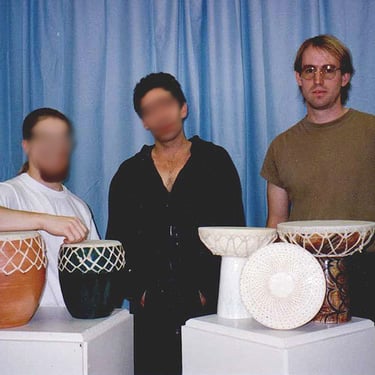 Patrick Brumm with friends making ceramic hand drums in federal prison