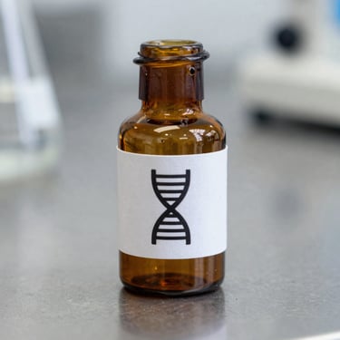 Amber glass research vial with a clean technical label showing a precise DNA-helix icon, resting on a sterile metal laboratory surface, sharp focus.