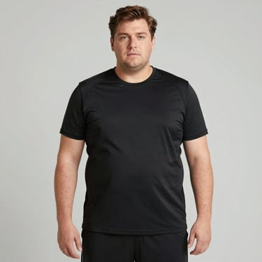 Middle-aged man jogging in the park, looking energized and focused