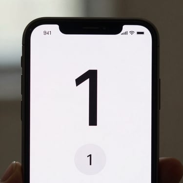 Close-up of an Android phone screen showing a minimal timer app UI — a single large countdown number on a near-white background, one start button, no other controls, soft indoor daylight, tight crop