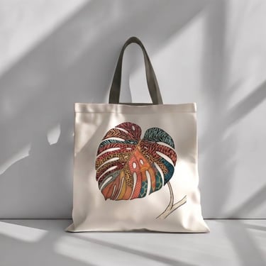 Tote bag con imagen de costilla de Adan con textura de animal print bordada a mano