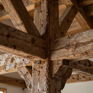 Close-up architectural detail of a restored oak timber joint in a traditional Cheshire barn conversion, natural light, honest texture.