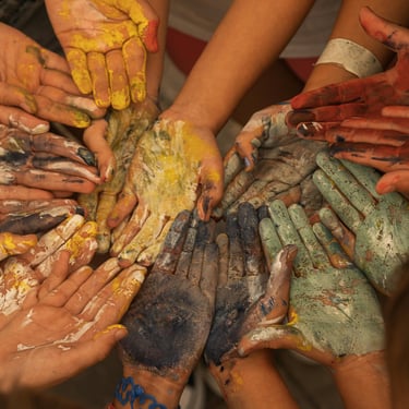Circle of hand with paint on during an intuitive painting workshop