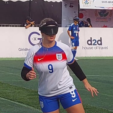 Football player wearing an England kit and protective eye shades during a blind football match