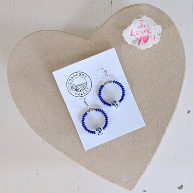 Charming Blue and White European Heritage Inspired Beaded Handmade Earrings on a Heart-Shaped Background
