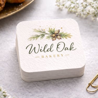 Business cards with rounded corners stacked neatly on a desk surface
