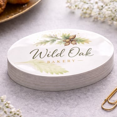 Oval shaped business card with soft edge contour and centered brand mark