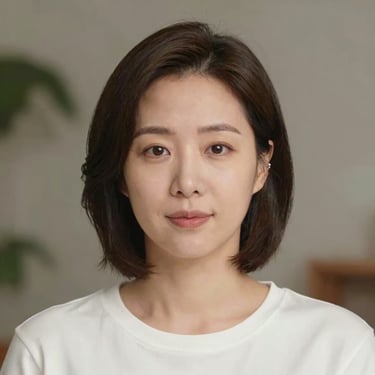 Smiling woman sitting at a cozy desk with headphones during an online English lesson.